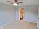 Bedroom featuring neutral walls, carpet, and an ensuite bathroom at 6412 Cradle River Dr, Indianapolis, IN 46221