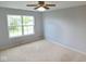 Bedroom featuring neutral walls, carpet, and a bright window at 6412 Cradle River Dr, Indianapolis, IN 46221