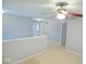 Spacious hallway with neutral walls and carpeted flooring at 6412 Cradle River Dr, Indianapolis, IN 46221