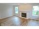 Spacious living room with hardwood flooring, fireplace, and neutral color palette at 6412 Cradle River Dr, Indianapolis, IN 46221