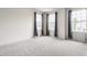Inviting bedroom with ample natural light and neutral carpet and wall finishes at 6537 Seabiscuit Rd, Whitestown, IN 46075