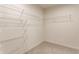 Walk-in closet features wire shelving and carpeted floor, offering plenty of storage space at 6537 Seabiscuit Rd, Whitestown, IN 46075