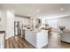 Spacious open concept kitchen with stainless steel appliances and kitchen island with seating at 6537 Seabiscuit Rd, Whitestown, IN 46075
