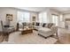 Bright living room featuring modern furniture, neutral color palette, and hardwood floors at 6537 Seabiscuit Rd, Whitestown, IN 46075