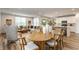 Open concept living room with modern furnishings connecting to a bright kitchen and dining area at 6537 Seabiscuit Rd, Whitestown, IN 46075