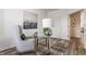 Office featuring a glass desk, decorative lamp, comfortable seating, neutral walls, and a patterned rug at 6537 Seabiscuit Rd, Whitestown, IN 46075