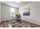 Office with a glass desk, comfortable seating, neutral walls, and a patterned rug at 6537 Seabiscuit Rd, Whitestown, IN 46075