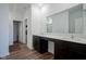 Bathroom features a double vanity with elegant countertops and dark cabinetry at 6608 W Shoreline Ct, Greenfield, IN 46140