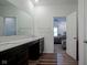 Bathroom features a double vanity and doorway to the main bedroom at 6608 W Shoreline Ct, Greenfield, IN 46140