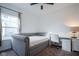 Bedroom with a daybed, double door closet, large window, carpet flooring, and a desk at 6608 W Shoreline Ct, Greenfield, IN 46140