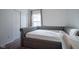 Bedroom with a daybed, double door closet, large window, and carpet flooring at 6608 W Shoreline Ct, Greenfield, IN 46140