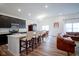 Bright, open-concept kitchen featuring a large island with seating and modern appliances at 6608 W Shoreline Ct, Greenfield, IN 46140