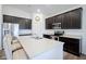 Well-equipped kitchen boasts sleek cabinets, stainless steel appliances, and a spacious island at 6608 W Shoreline Ct, Greenfield, IN 46140