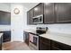 Contemporary kitchen with sleek stainless steel appliances and elegant quartz countertops at 6608 W Shoreline Ct, Greenfield, IN 46140