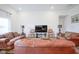 Comfortable living room featuring a decorative rug and large leather sofa at 6608 W Shoreline Ct, Greenfield, IN 46140