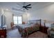 Comfortable main bedroom with carpet flooring, ceiling fan, and natural light at 6608 W Shoreline Ct, Greenfield, IN 46140