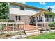 Spacious back deck with outdoor seating, grill, and access to sunroom; perfect for relaxing and entertaining at 664 N Scott Dr, Greenwood, IN 46142