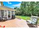 Relaxing back deck featuring a grill and comfortable seating overlooking lush green lawn at 664 N Scott Dr, Greenwood, IN 46142