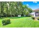 Expansive back yard with a storage shed and well-maintained lawn, offering privacy and space for outdoor enjoyment at 664 N Scott Dr, Greenwood, IN 46142