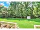 Beautiful back yard showcasing a large grassy area and mature trees, perfect for outdoor activities and recreation at 664 N Scott Dr, Greenwood, IN 46142