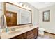 Bathroom featuring double sinks, a vanity, and a large mirror at 664 N Scott Dr, Greenwood, IN 46142