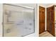 Bathroom shower with a frosted glass door and wood trim at 664 N Scott Dr, Greenwood, IN 46142