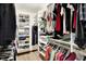 Organized walk-in closet with built-in shelving and hanging rods at 664 N Scott Dr, Greenwood, IN 46142