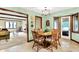 Cozy dining area with a round table, chairs, and views into the living room at 664 N Scott Dr, Greenwood, IN 46142