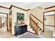 Welcoming foyer with a staircase, decorative mirror, and neutral color scheme at 664 N Scott Dr, Greenwood, IN 46142