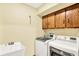 Laundry room featuring a utility sink, washer, and dryer at 664 N Scott Dr, Greenwood, IN 46142