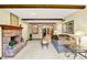 Inviting living room with a brick fireplace, neutral carpet, and comfortable seating at 664 N Scott Dr, Greenwood, IN 46142