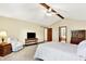Relaxing main bedroom boasts vaulted ceilings, comfortable furniture, and ample closet space at 664 N Scott Dr, Greenwood, IN 46142