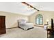 Comfortable main bedroom boasts vaulted ceilings, arched windows and neutral decor at 664 N Scott Dr, Greenwood, IN 46142