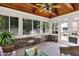 Bright sunroom with ample natural light, wood ceiling and cozy seating at 664 N Scott Dr, Greenwood, IN 46142