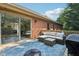Outdoor deck with wicker furniture, providing a cozy and stylish space for relaxing and entertaining at 7029 Kingswood Cir, Indianapolis, IN 46256