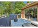 Outdoor deck with grilling area, seamlessly connected to the home with a sliding glass door, offering convenient outdoor living at 7029 Kingswood Cir, Indianapolis, IN 46256