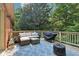 Outdoor deck with wicker furniture, providing a cozy space for relaxing and entertaining outdoors at 7029 Kingswood Cir, Indianapolis, IN 46256