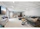 Finished basement with a large sectional sofa, a play area for , and a neutral color scheme at 7029 Kingswood Cir, Indianapolis, IN 46256