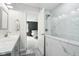 Elegant bathroom showcasing modern fixtures and a glass-enclosed shower and view to bedroom at 7029 Kingswood Cir, Indianapolis, IN 46256