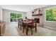 Cozy dining room with a fireplace and sliding glass doors to a deck at 7029 Kingswood Cir, Indianapolis, IN 46256