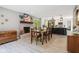 Open floor plan dining room connected to the kitchen with a brick fireplace at 7029 Kingswood Cir, Indianapolis, IN 46256