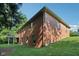Rear exterior of the brick home with a deck, showcasing its architecture and outdoor living space at 7029 Kingswood Cir, Indianapolis, IN 46256