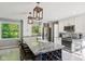 Well-equipped kitchen with granite counters, stainless appliances, and wine rack at 7029 Kingswood Cir, Indianapolis, IN 46256