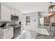 Bright kitchen with white cabinets, stainless steel appliances, and granite countertops at 7029 Kingswood Cir, Indianapolis, IN 46256