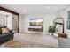 Modern living room with a mounted TV, stylish decor, and comfortable seating arrangements at 7029 Kingswood Cir, Indianapolis, IN 46256