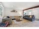 Spacious living room with a mix of textures, comfortable seating, and an open view to other living spaces at 7029 Kingswood Cir, Indianapolis, IN 46256