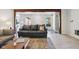 Bright living room with hardwood floors and view into the kitchen at 7029 Kingswood Cir, Indianapolis, IN 46256