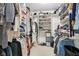 Well-organized walk-in closet with ample shelving and hanging space for clothing and shoes at 7029 Kingswood Cir, Indianapolis, IN 46256