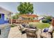 Backyard featuring lounge area with chairs, a dining set and a shed at 712 Orange St, Indianapolis, IN 46203