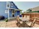 Backyard deck featuring outdoor dining set and access to the house at 712 Orange St, Indianapolis, IN 46203